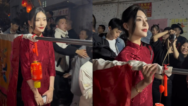 女生穿旗袍扛标旗慢步不断眨眼扭头观察四周，颜值令网友不淡定！-第1张图片-9158手机教程网